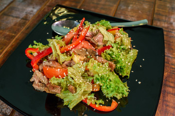 King salad on a large wooden table