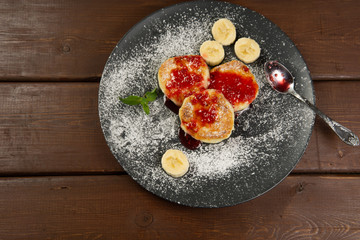 Cottage cheese pancakes on a dark plate