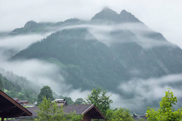 Low morning clouds and haze floating in the valleys of the mountains around Fusch an der Grossglocknerstrasse