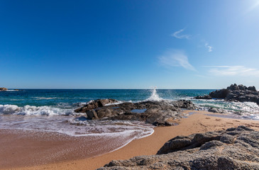 On a beach in Lloret de Mar, water in peace and movement