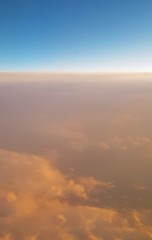 landscape above the clouds from airplane