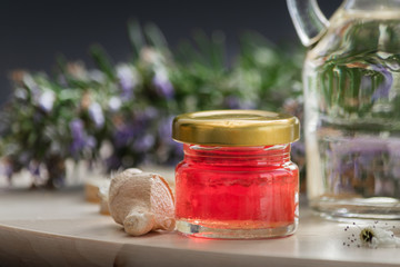 Close up red balsam in jar and ginger.