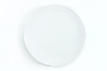 Empty plate on dark stone background.