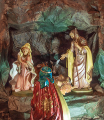 crib with the Holy Family in a cave