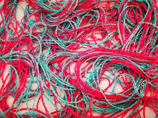 Background of bright pink and blue threads