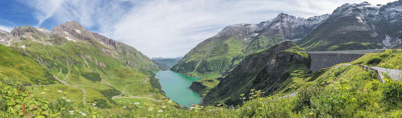Naklejka na ściany i meble Panorama of the Wasserfallboden reservoir and the surrounding mountains, seen from the Mooserboden reservoir
