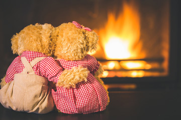 Teddy bears in  fireplace