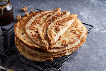 Traditional homemade pancakes with berry jam served on gray stone table Top view Copy space.