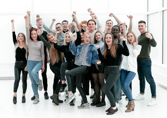 Fototapeta premium group of happy youths who are pointing ahead