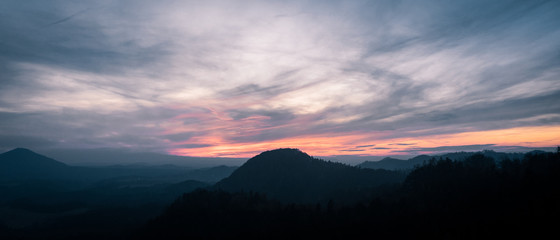 Sun breaking through after a storm on an autumn afternoon over Jetrichovice, beautiful landscape,...