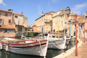 Fototapeta na wymiar The old harbor of Martigues with traditional wooden boat. Martigues, called the Little Venice of Provence, France