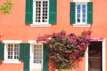 Fototapeta na wymiar Traditional houses with colorful facades and wooden window shutters in the historic center of Martigues, the Little Venice of Provence, France 