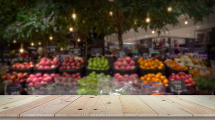 Fototapeta na wymiar Empty wood table top with fruit market blurred background