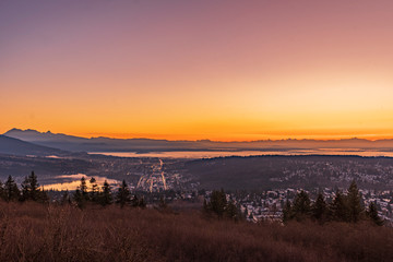 Welcoming in a new day from a UniverCity balcony - sunrising over distant mountains, highlightinh cloud cover over Fraser River