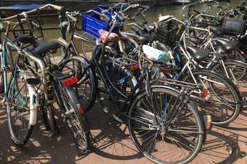 Fototapeta na wymiar Bicycle Parking on the waterfront, Amsterdam, Netherlands, concept of ecology and healthy lifestyle