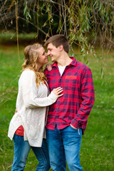 Fototapeta premium Smiling young adult couple that is about to kiss