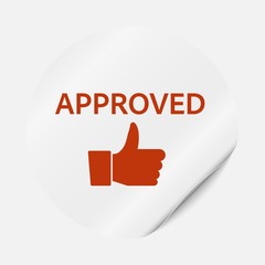 Round sticker with bent corner, the inscription is approved and the sign is thumb up.