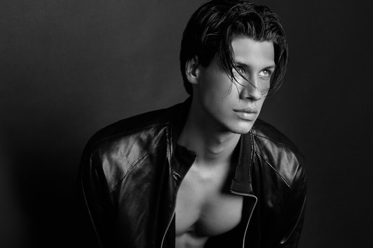 Muscle strong beautiful stripped male model portrait on isolated font background with shadow