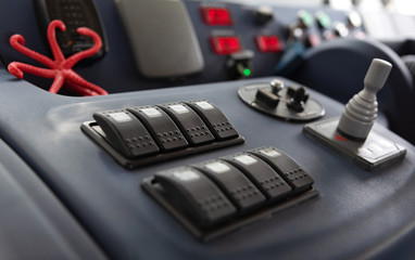 Instruments and gauges on dashboard used by boat captain when steering vessel from lower deck on...