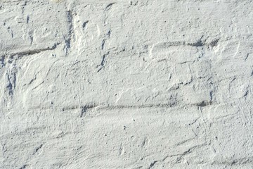 weiß gestrichene alte Steinwand