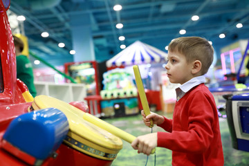 Child playing drum