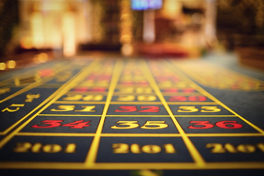 Roulette table in a casino closeup.