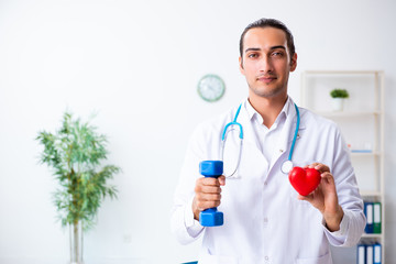 Young male doctor in sport and dieting concept