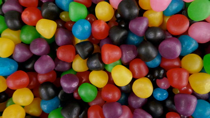 Delicious fruit sweets.  Colorful fruit dragees, with soft filling. Close-up.