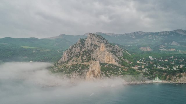 Over the fog. Rocks and sea. Simeiz. Crimea. Russia.