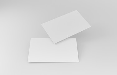 Two empty white business cards. Mockup for branding identity. Blank name card or poster on white background, studio shot. great for text & logo for design creative concept. 3D illustration