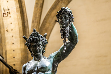 Bronze statue of Perseus holding the head of Medusa in Florence, made by Benvenuto Cellini in 1545