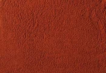 Red paprika powder background and texture