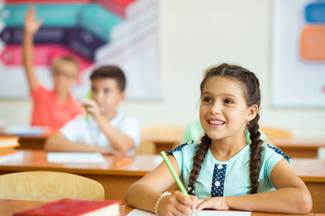 Children studying in classroom at the school