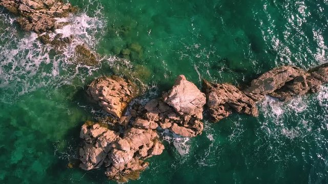 Adriatic sea waves on Croatian rocks. Footage from air.