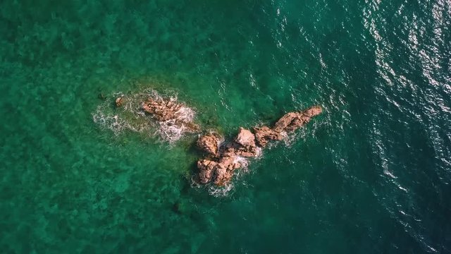 Adriatic sea waves on Croatian rocks. Footage from air.