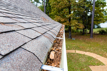 Gutter on home full of leaves and pinestraw