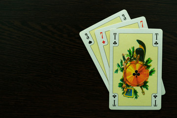 cards from the playing deck, three of sevens and ace, as a symbol of gaming addiction and casino....