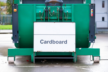 Cardboard recycle green bin macerator container at recycling plant business