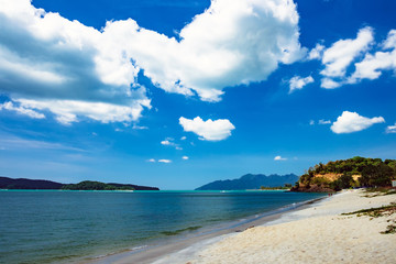 Relaxing on remote paradise beach. Untouched sandy beach with white sand in Langkawi Island, Malaysia.