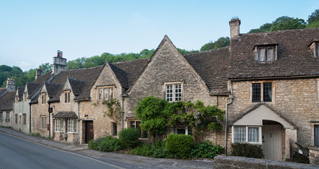 CASTLE COMBE, COTSWOLDS, UK - MAY 26, 2018:  Typical and picturesque English countryside cottages in Castle Combe Village, Cotswolds, Wiltshire, England - UK