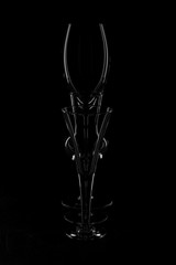 Empty glass glass for wine and liquor on a dark background.