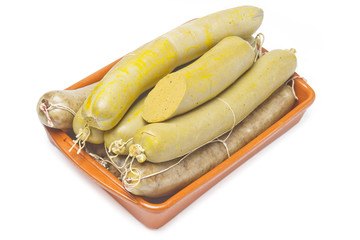 liver sausage, in a plate on a white background