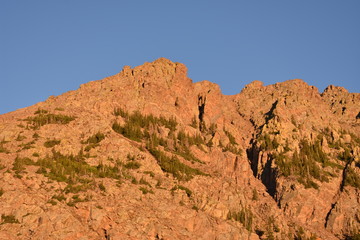 The sun sets over the mountains of the Colorado Rockies.