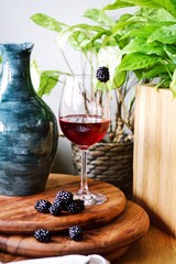 Red Wine in a glass on a wooden table