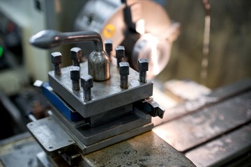 Old metal lathe machine, retro machine background.