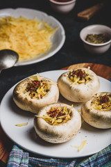 Button mushrooms stuffed with cheese and spices