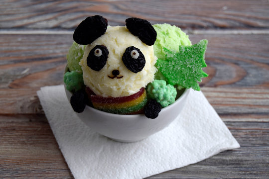 Ice cream is made in form of panda. Creative dessert for for children. Dish for New Year and Christmas
