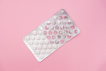 A half used blister pack with sedative pills on pink background to prevent nervousness, irritability and insomnia