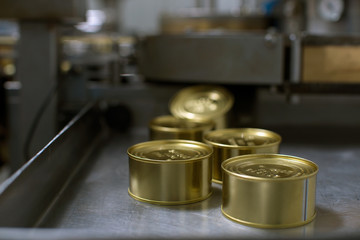 packing of caviar in a tin can, at a fish factory