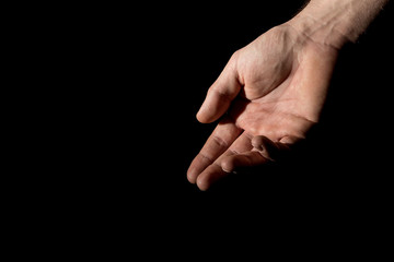 Men's palm in full dark under studio lighting, or "Helping Hand"
